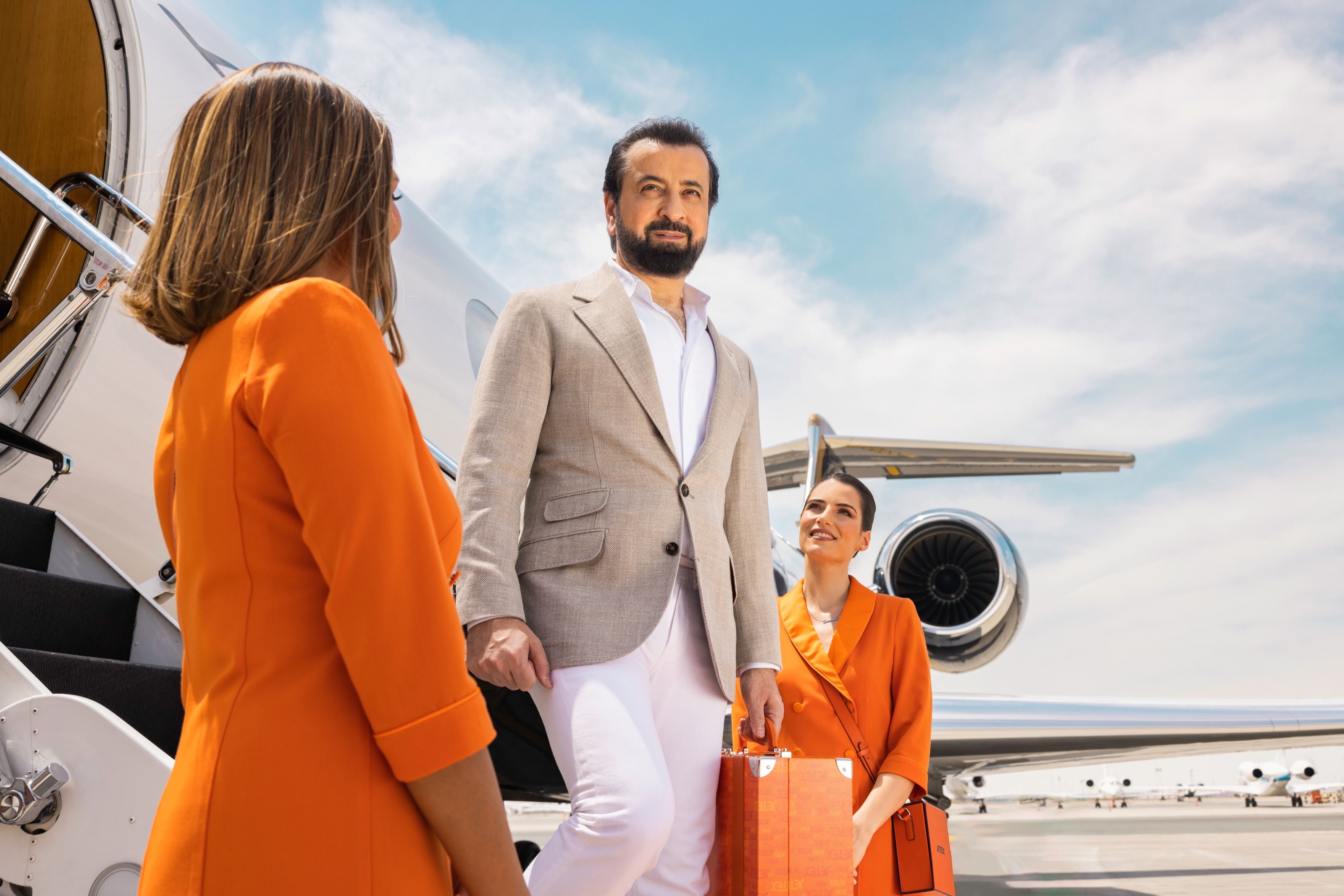 Adel Mardini stepping off a private jet, welcomed by Jetex crew in Dubai