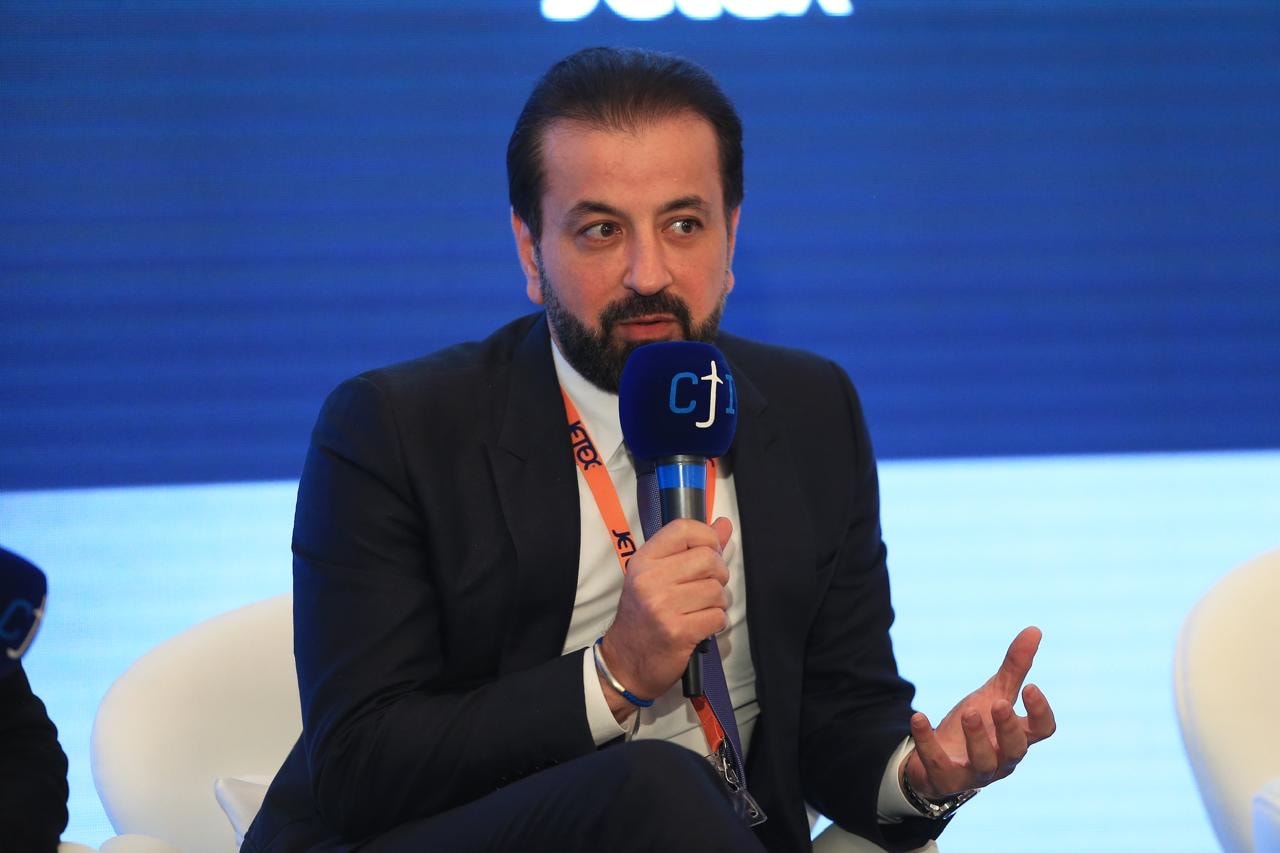 Adel Mardini speaking as a panel guest